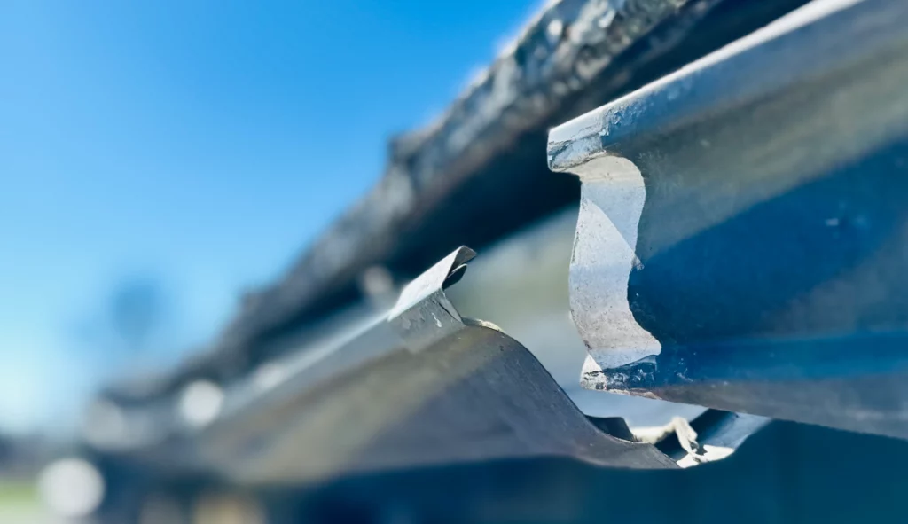 Before-and-after gutter replacement system showing old gutters
